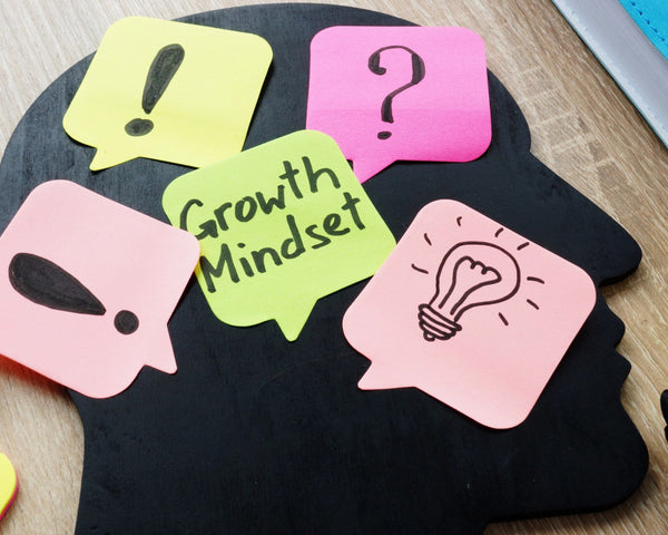 Students working on a summer-themed digital escape room activity that teaches growth mindset through interactive beach scenarios and critical thinking choices.